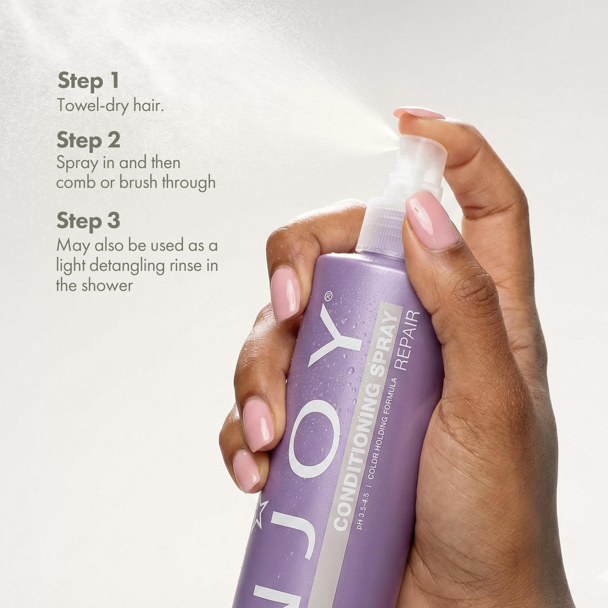 Enjoy conditioning spray applied to damp hair demonstrating hydration and manageability benefit