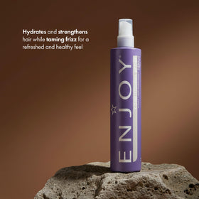 Enjoy conditioning spray misting action on hair for instant detangling benefit