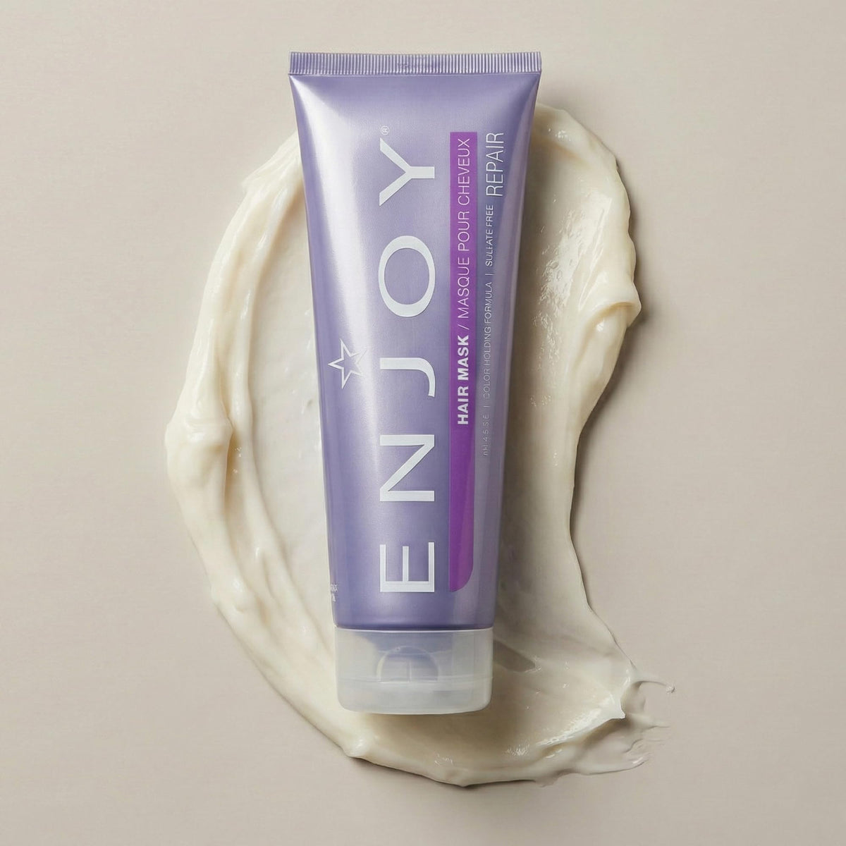 Enjoy hair mask next to a ruler showing the 8 oz size and portability