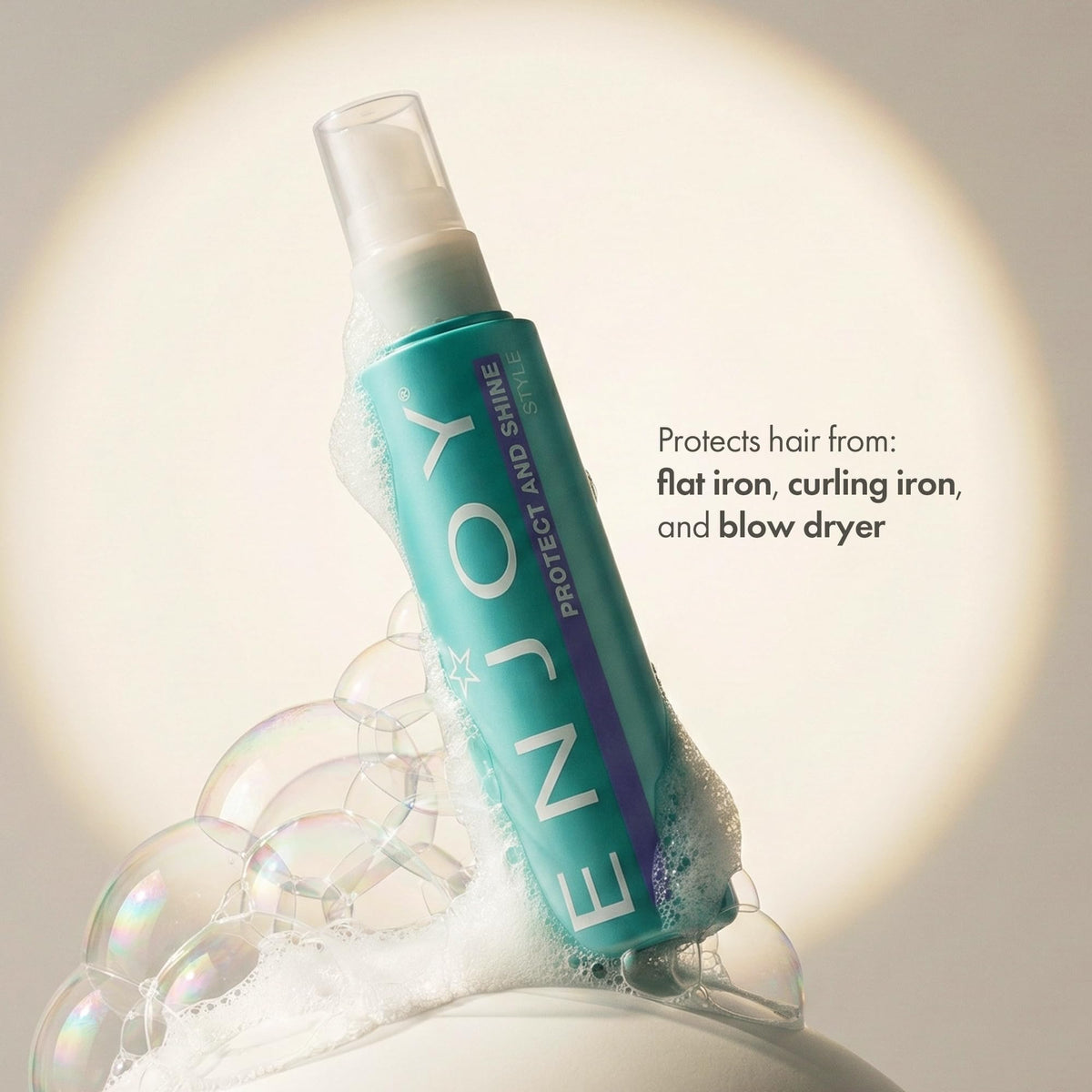 Enjoy label close-up showing features like shine, anti-frizz, and deodorizing