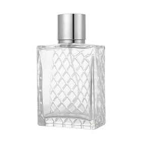 Enslz 100ml bottle next to coin to show accurate size and portability
