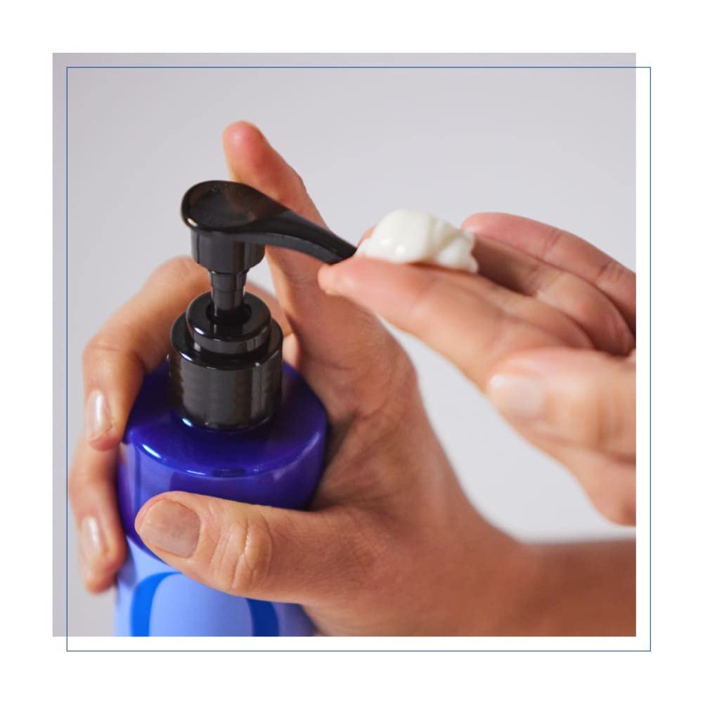 Hand holding EO French Lavender bottle to show dispensing and control for massage