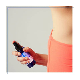 EO shower gel on loofah in use creating lather for gentle cleansing