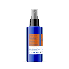 EO bottle in hand to show 4-ounce size and portable convenience for travel