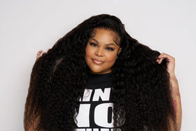 Ericka J on a vanity with tools showing salon-quality styling results