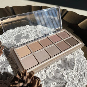 Erinde palette held in hand to show compact scale and portability benefit