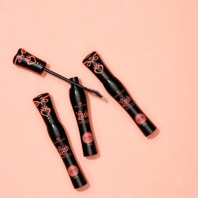 essence mascara held in hand to show scale and ease-of-use benefit