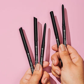 essence five pencils beside a makeup bag illustrating ready-to-go touchups