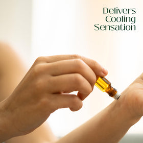 Essentially KateS peppermint oil drop on skin close-up illustrating dilution and topical use benefit