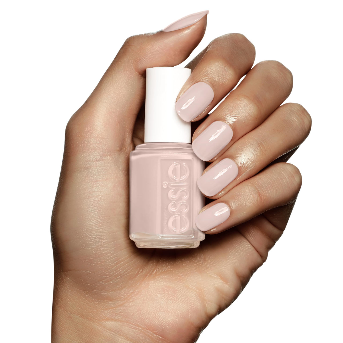 essie polish being applied on fingertips for a quick at-home manicure look