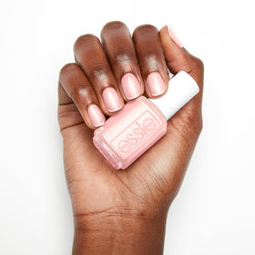 essie lifestyle handshot on a neutral background showing wearable everyday shine