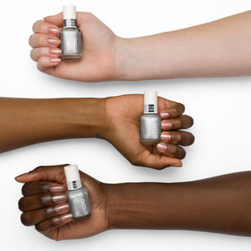 essie nail swatch on light base showing pearlescent glow and subtle chrome effect