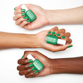 essie bottle label closeup showing shade name Grass Never Greener and brand