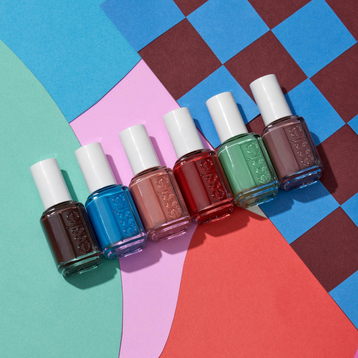 essie in hand scale shot showing bottle size and easy handling for at-home use