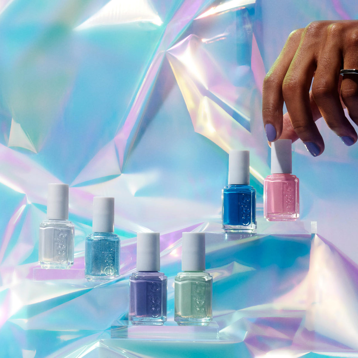 essie Just Chill being painted on nails for salon-quality glossy coverage