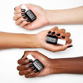 essie Licorice swatch on nails highlighting opaque coverage and salon shine