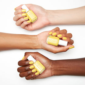 essie swatch on nails demonstrating soft yellow-green color payoff