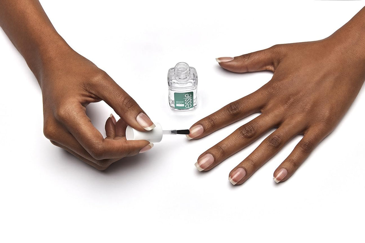 essie clear coat applied on nail delivering smooth base for polish