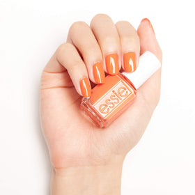 essie hand nail swatch painted in tangerine showing finished look benefit: wearable summer color