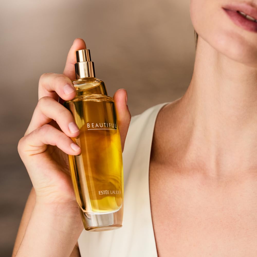 Estée Lauder Beautiful 3.4 oz bottle next to everyday objects for size and scale clarity