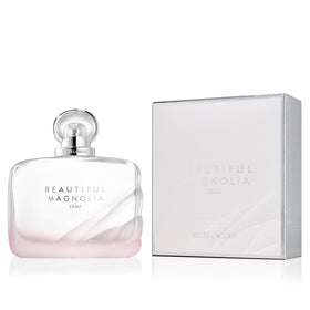 Estée Lauder travel bottle beside a coin showing size comparison for easy portability