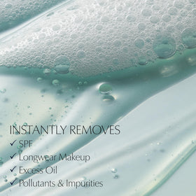 Estée Lauder bottle label detail highlighting ingredient callouts and product name