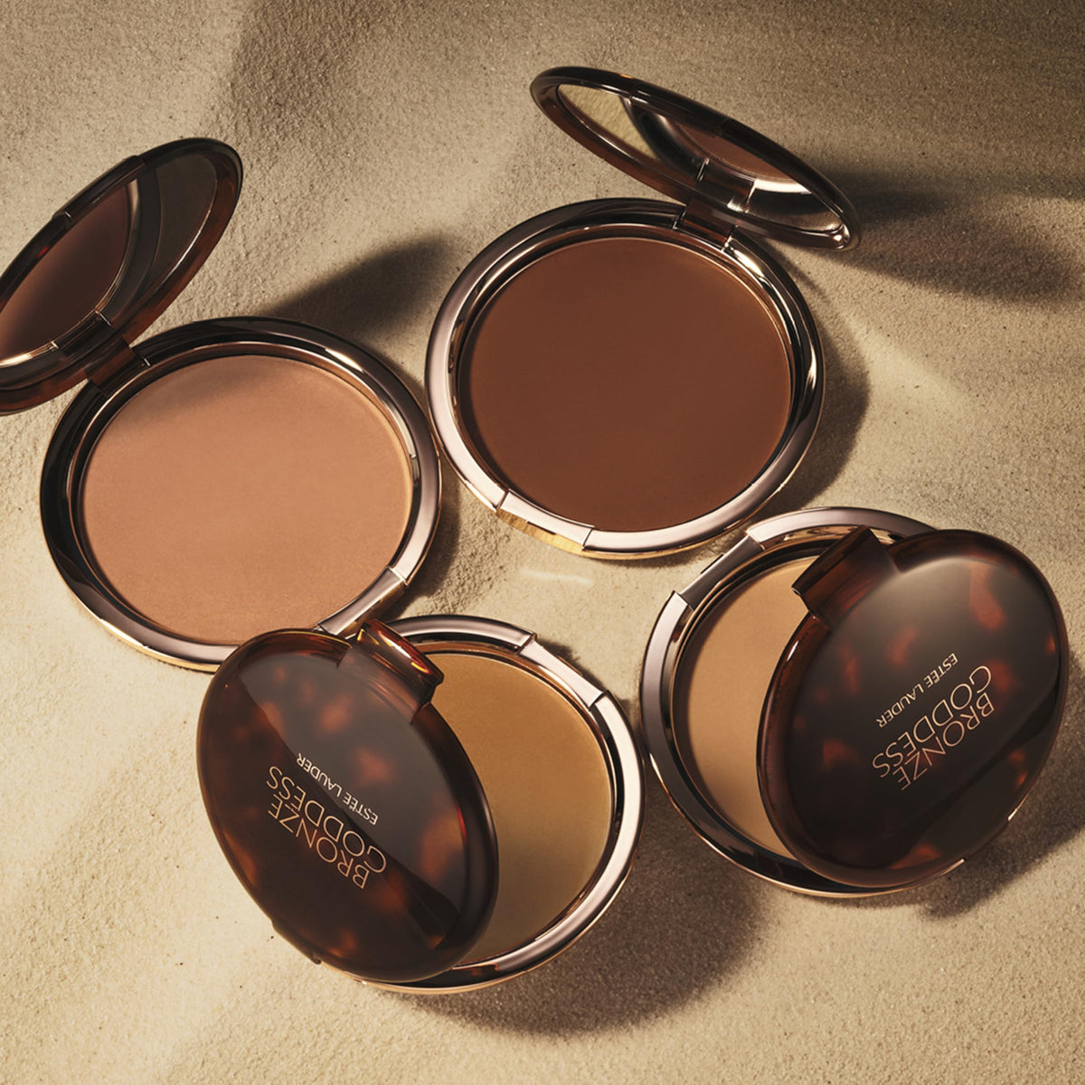 Estée Lauder bronzer applied to shoulder demonstrating natural sun-kissed benefit