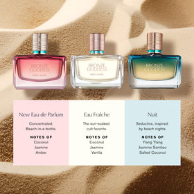 Estée Lauder Bronze Goddess Nuit bottle on a sandy beach to evoke warm nocturnal mood