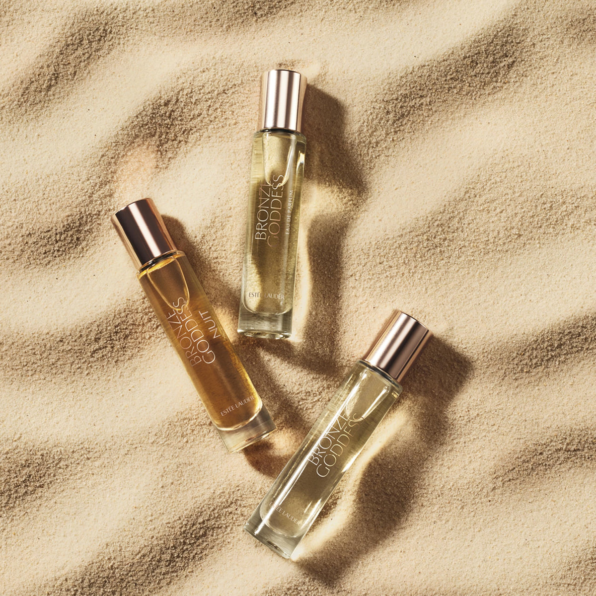 Estée Lauder Bronze Goddess Nuit next to key to show travel-size portability benefit