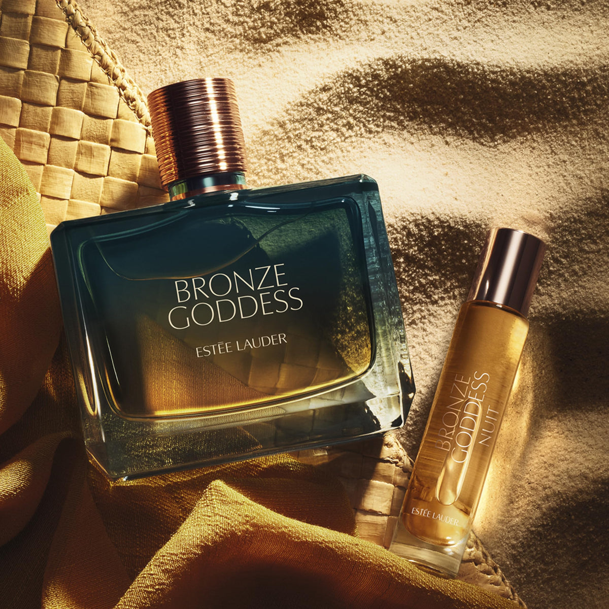 Estée Lauder Bronze Goddess Nuit spray applied from travel bottle for easy on‑the‑go refresh
