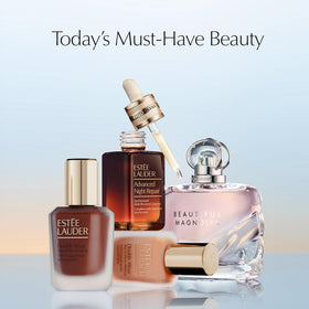 Estée Lauder bottle next to a ruler showing the 3.4 fl oz size for scale
