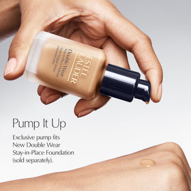 Estée Lauder pump nozzle close-up highlighting controlled dispensing control