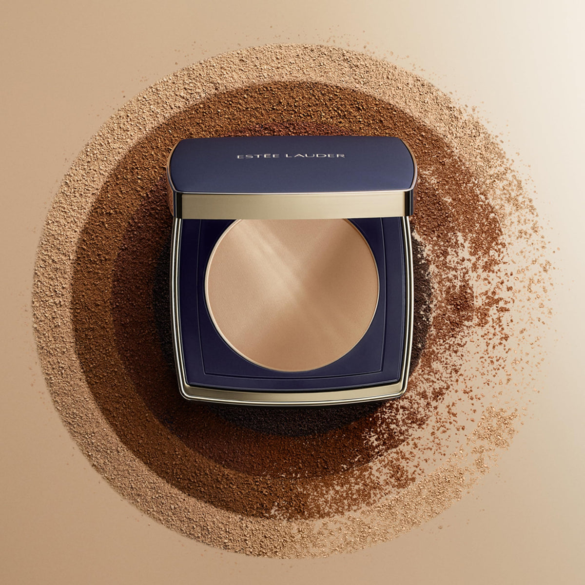 Estée Lauder compact held in hand to show size benefit: portable for touch-ups
