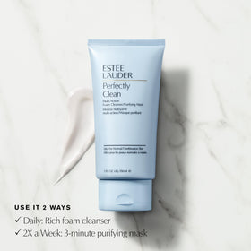 Estée Lauder 5 oz bottle held in hand to show scale and travel-friendly size benefit