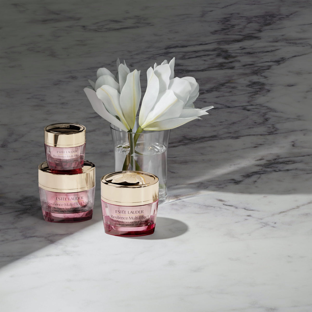 Estée Lauder jar next to hand for scale showing 1.7 oz size and travel readiness