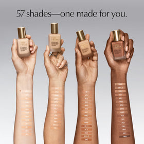 Estée Lauder bottle beside ruler showing 1 fl oz size and travel-friendly benefit