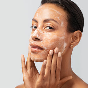 Estée Lauder cleanser dispensed in hand demonstrating usable size and lather
