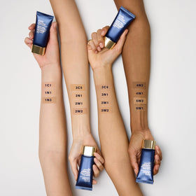 Estée Lauder before and after tattoo cover showing waterproof concealment benefit