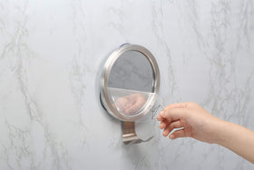 Ettori mounted mirror in shower with person shaving demonstrating convenience and visibility