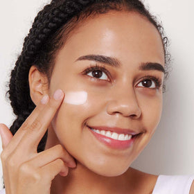 ETUDE cream being applied with finger showing smooth spreadability benefit