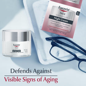 Eucerin 1.7 oz jar next to ruler to show portable size and travel-friendly benefit
