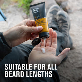 Every Man Jack bottle beside beard brush showing compatibility with grooming tools