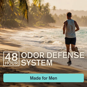 Every Man Jack stick held in hand to show travel-friendly 2.6 oz size and portability