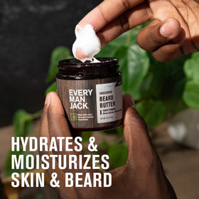Every Man Jack man applying beard butter in mirror for hydration