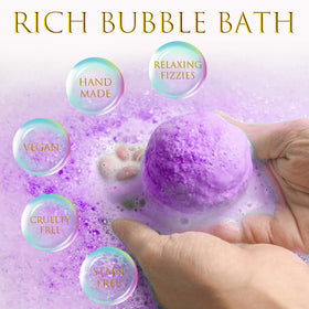 Excalla bath bomb dissolving in tub producing bubbles and aromatic steam benefit