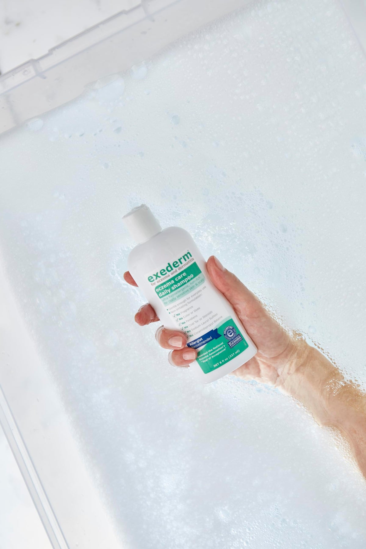 Exederm low-foam lather texture demonstrating mild cleansing action