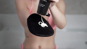 Existing Beauty exfoliating mitt detail showing textured surface for tan removal