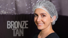 Existing Beauty model wearing net during spray tan keeping hair clean and out of spray