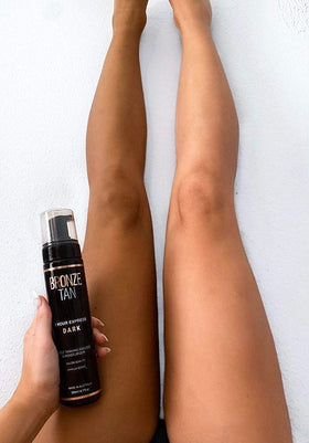 Existing Beauty mousse applied with mitt demonstrating streak-free, even application