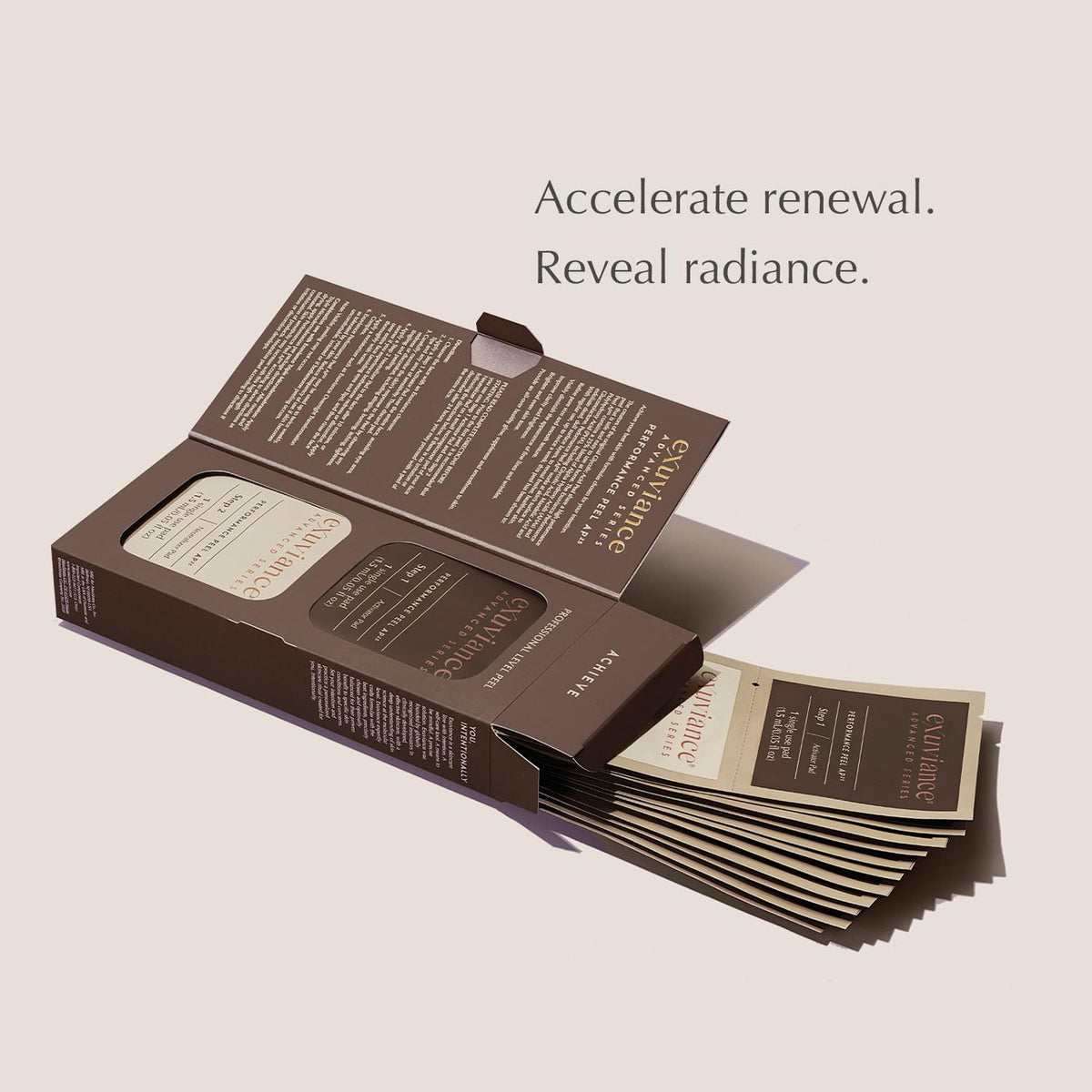 EXUVIANCE peel pads beside hand to show kit scale and portability